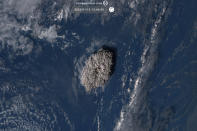 This satellite image taken by Himawari-8, a Japanese weather satellite operated by Japan Meteorological Agency and released by National Institute of Information and Communications Technology (NICT), shows an undersea volcano eruption at the Pacific nation of Tonga Saturday, Jan. 15, 2022. (NICT via AP)