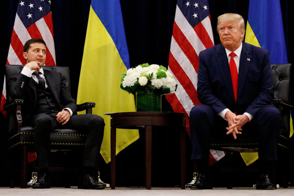 FILE - In this Sept. 25, 2019 file photo, President Donald Trump meets with Ukrainian President Volodymyr Zelenskiy in New York during the United Nations General Assembly. Trump's demand that Ukraine look into its own purported interference in the 2016 U.S. election and investigate a political rival, former Vice President Joe Biden, while the U.S. withheld the aid is at the heart of the congressional investigation that produced Trump's impeachment in the House on charges of abuse of power and obstruction of Congress. (AP Photo/Evan Vucci, File)