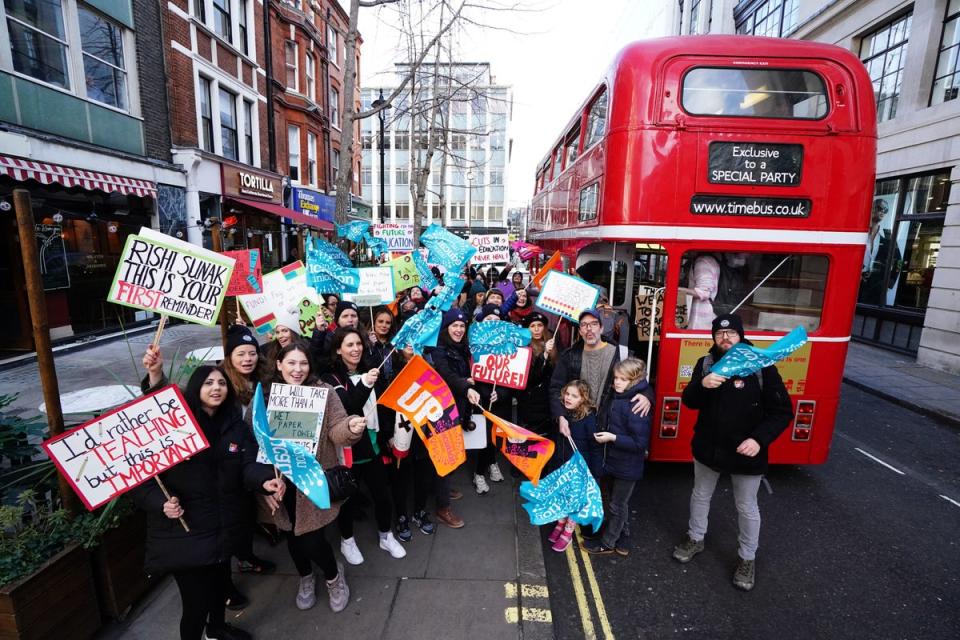 Striking teachers from the National Education Union (NEU) disembark a routemaster bus in Soho, central London, as they travel to the Protect The Right To Strike march and rally, against the Strikes (Minimum Service Levels) Bil (PA)