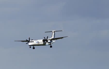 A Flybe aircraft lands at Edinburgh Airport in Scotland May 24, 2011.REUTERS/David Moir