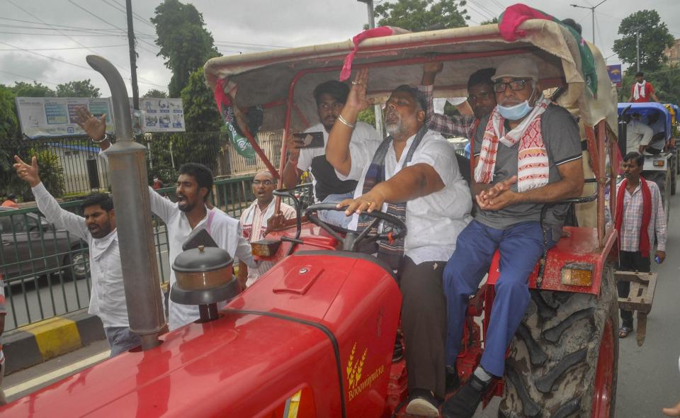 Jan Adhikar Party Chief Pappu Yadav rides a tractor during 'Bharat Bandh', a protest against the farm bills passed in Parliament recently, in Patna, Friday, Sept. 25, 2020. (PTI Photo)