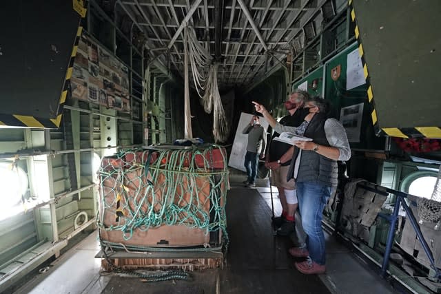 Three people view the interior of the only remaining RAF XB259 Blackburn Beverley C1 heavy transport plane (Owen Humphreys/PA)