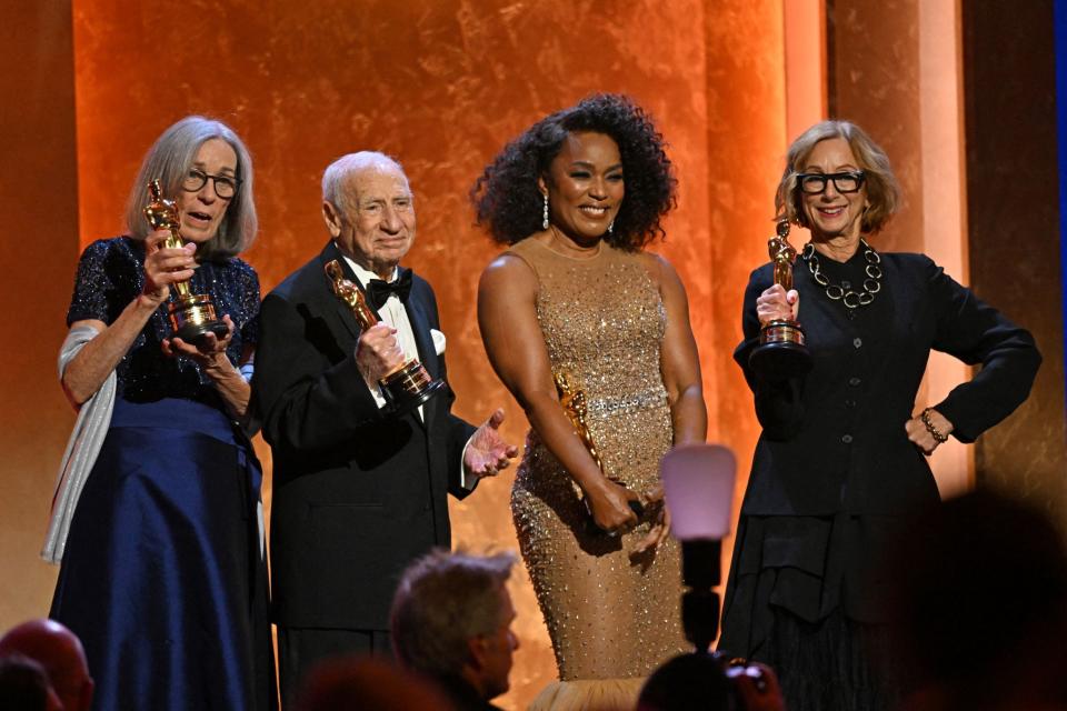 Carol Littleton, Mel Brooks and Angela Bassett pose with their honorary Oscars as Michelle Satter poses with the Jean Hersholt Humanitarian Award.