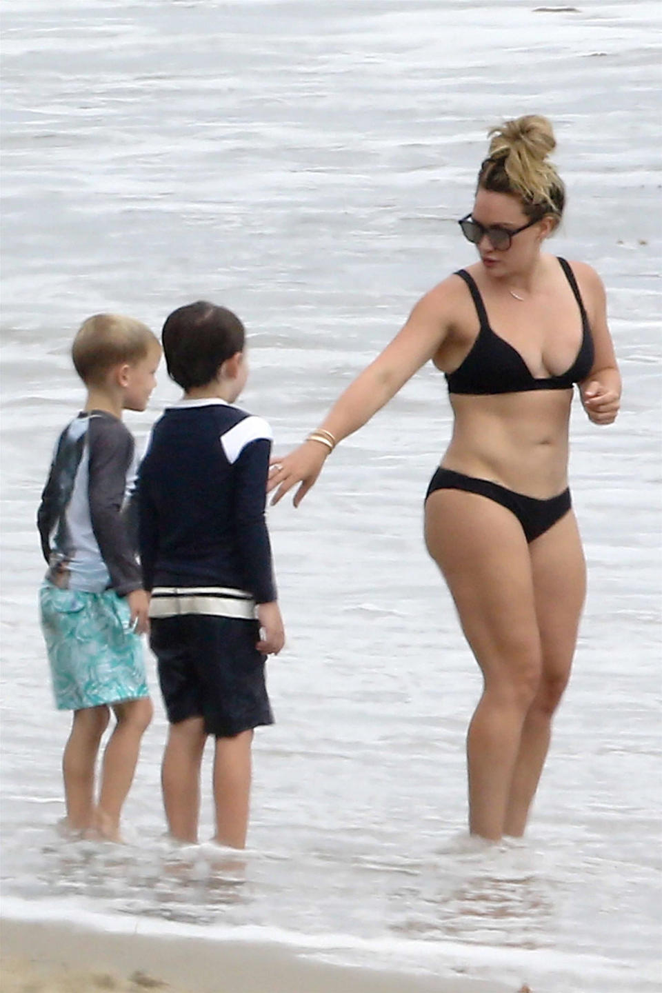 Hilary Duff celebrated Labor Day at the beach with her son, Luca (pictured at far left with a friend), and her ex-husband, Mike Comrie. (Photo: AKM-GSI)