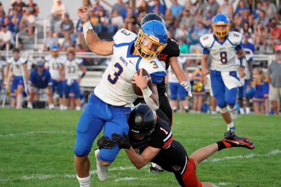 East Canton's Brennan Betz (3) is caught from behind during first-quarter action against Dalton.