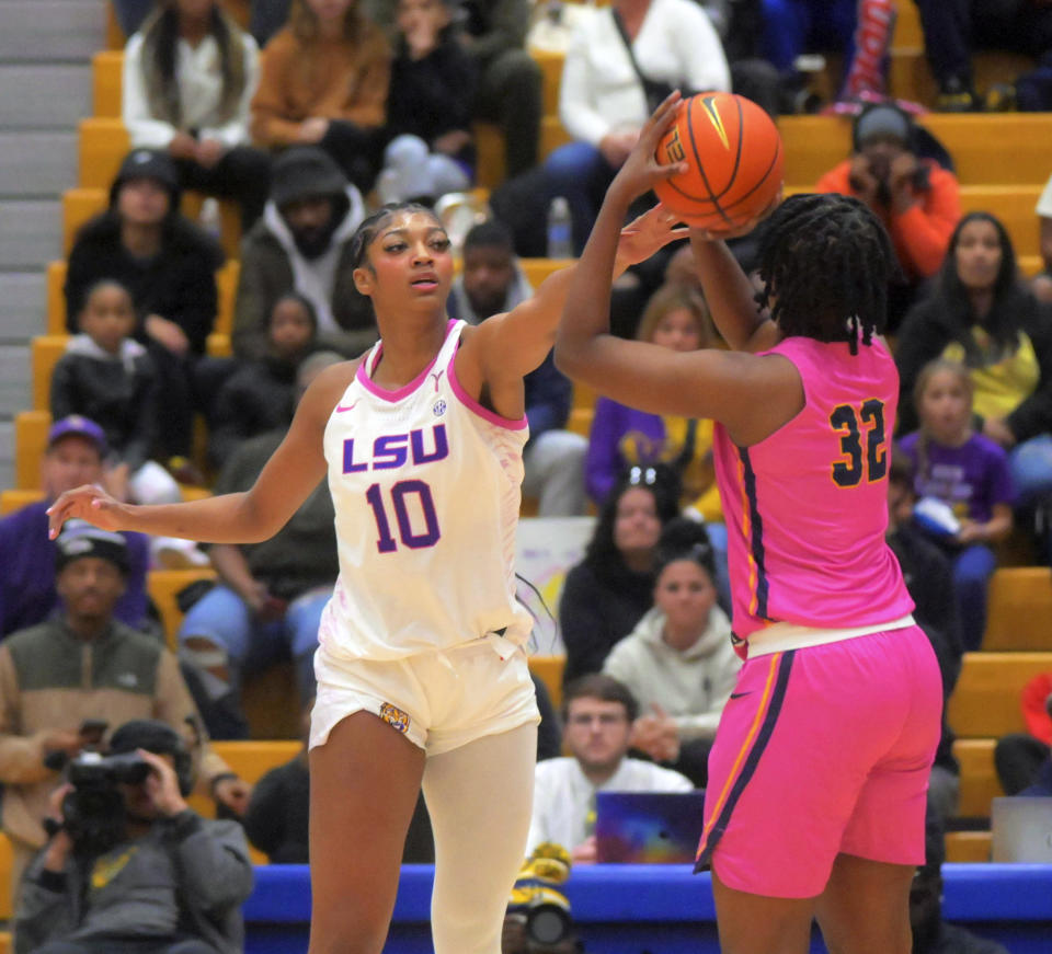 LSU forward Angel Reese (10) guards Coppin State forward Laila Lawrence (32) during an NCAA college basketball game Wednesday, Dec. 20, 2023 in Baltimore. (Karl Merton Ferron/The Baltimore Sun via AP)