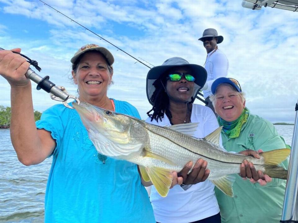 Second-place inshore fishing winner Anita Laico, celebrating with Kristin Hudson, Mary Jane Provencher and Roy Hudson, caught a 31-inch snook on Capt. Chris Hanson’s Scales 2 Tales.