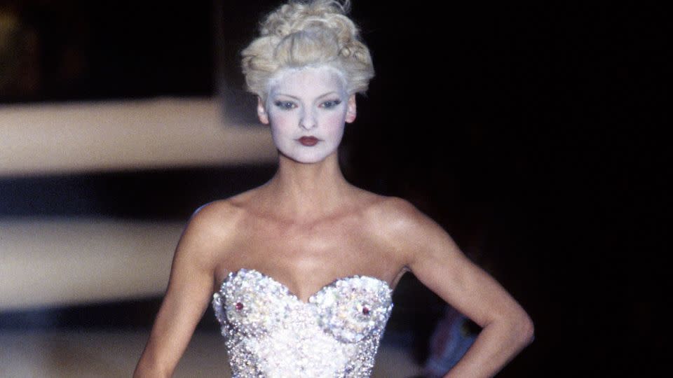 The 1990s era of Vivienne Westwood was defined by shape and silhouette, as demonstrated here with Linda Evangelista walking the Fall-Winter 1995 show in Paris. - PL Gould/Getty Images