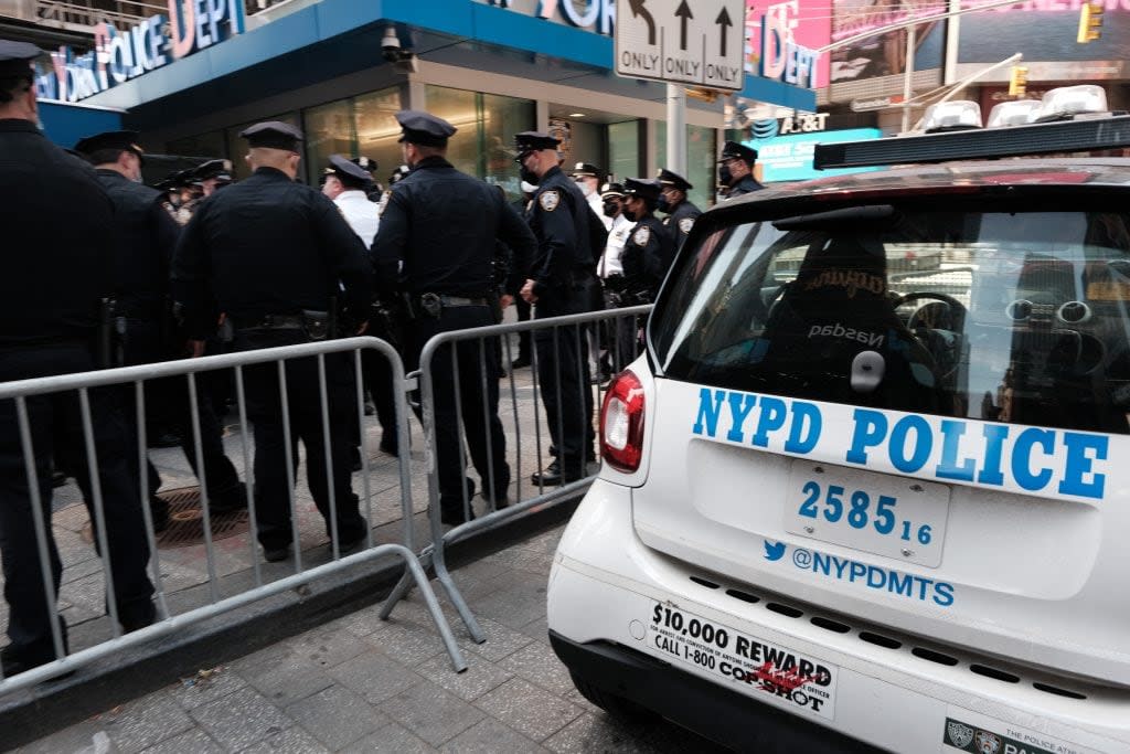 Members of the NYPD congregate in Times Square near a police precinct for a security briefing as security throughout the city is increased ahead of a verdict in the Derek Chauvin trial on April 20, 2021 in New York City. Across the nation and world, people are waiting for the verdict in the trial in which the former Minneapolis police officer kneeled on the neck of George Floyd and is on trial for killing him. Demonstrations erupted around the world following Floyd’s death. (Photo by Spencer Platt/Getty Images)