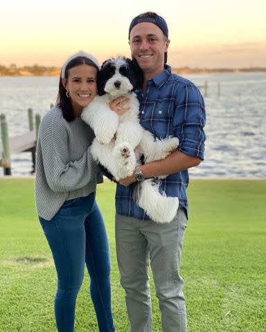 Justin Thomas Instagram Justin Thomas and Jillian Wisniewski with their dog Franklin.