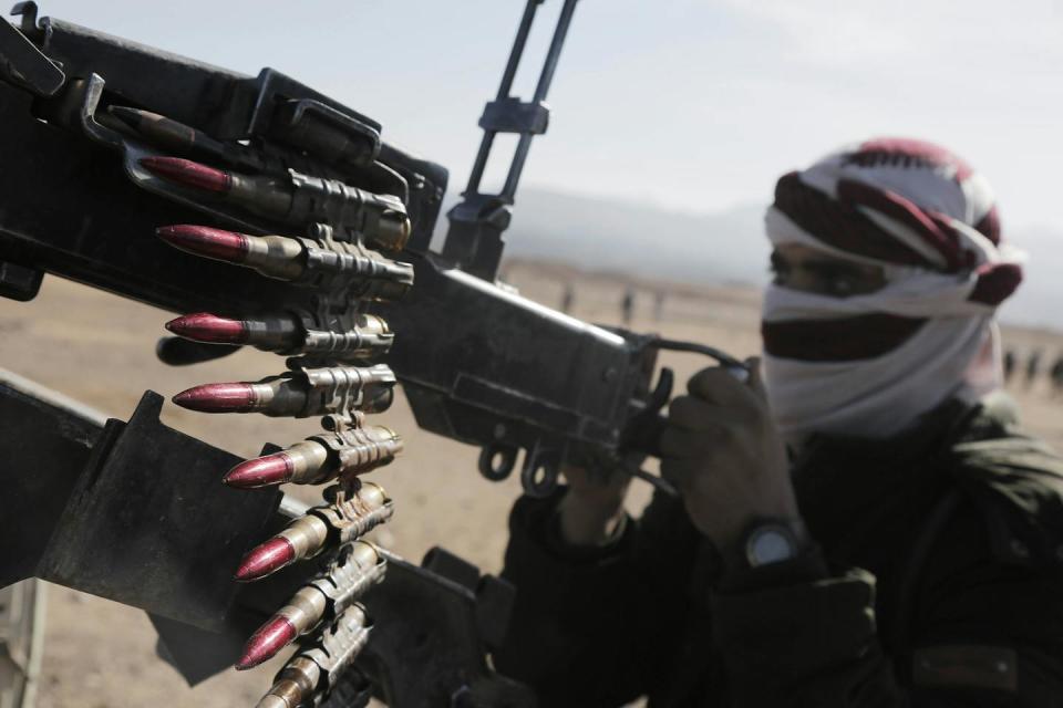 A Houthi supporter in Sanaa, Yemen. <a href="https://www.gettyimages.com/detail/news-photo/houthi-supporters-gather-as-they-carry-heavy-weapons-and-news-photo/1945478590?adppopup=true" rel="nofollow noopener" target="_blank" data-ylk="slk:Mohammed Hamoud/Anadolu via Getty Images;elm:context_link;itc:0;sec:content-canvas" class="link ">Mohammed Hamoud/Anadolu via Getty Images</a>