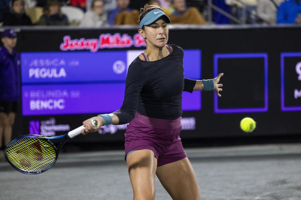 Belinda Bencic, of Switzerland, returns a shot to Jessica Pegula during semifinal action at the Charleston Open tennis tournament in Charleston, S.C., Saturday, April 8, 2023. (AP Photo/Mic Smith)