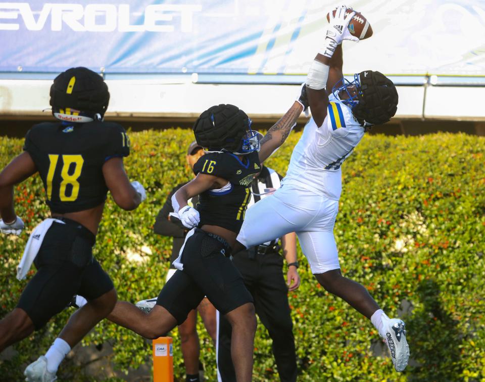 Delaware wide receiver Kym Wimberly makes a grab for a touchdown in front of defensive back Micah Pr'out during the Blue and White Spring Game on April 21, 2023, at Delaware Stadium.