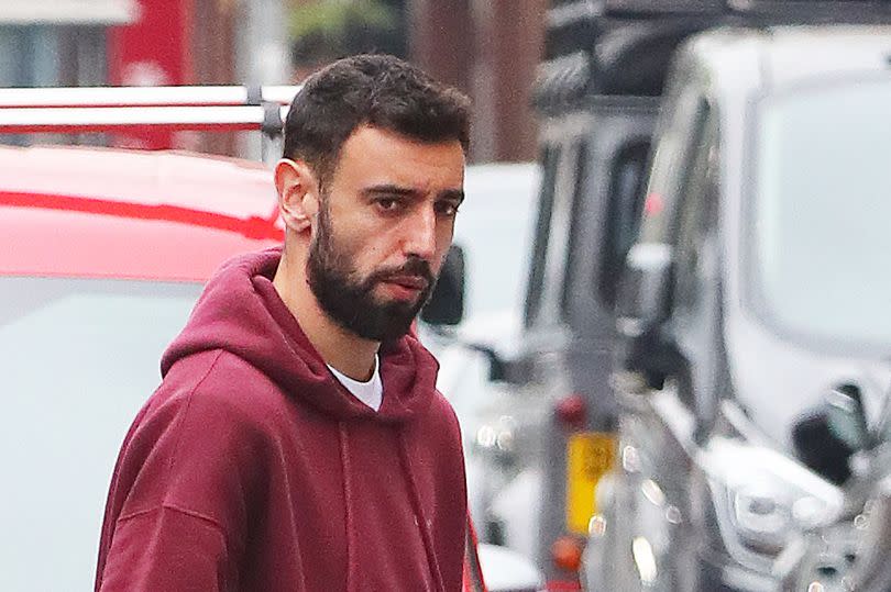 Bruno Fernandes leaves a coffee shop in Wilmslow with his injured hand in a protective cast -Credit:Eamonn and James Clarke