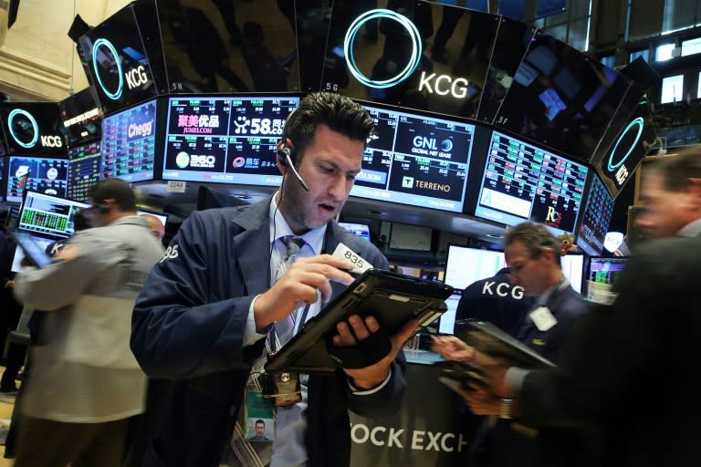 Traders work on the floor of the New York Stock Exchange on November 30, 2015