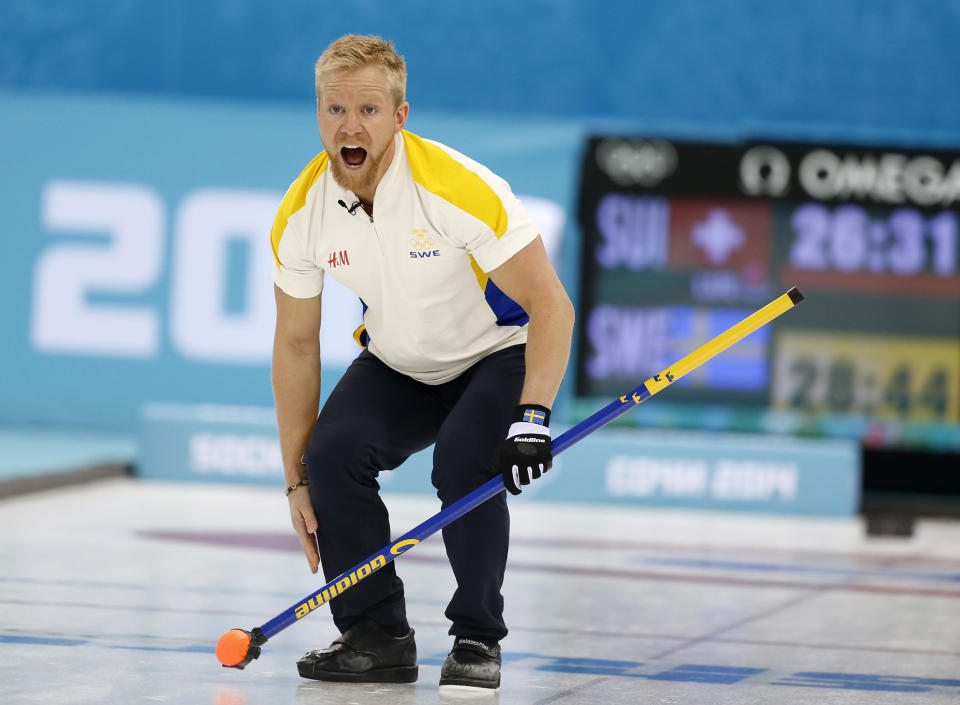 Sweden’s skip Niklas Edin shouts instructions after delivering the rock in men's curling competition against Switzerland at the 2014 Winter Olympics, Monday, Feb. 10, 2014, in Sochi, Russia. (AP Photo/Robert F. Bukaty)