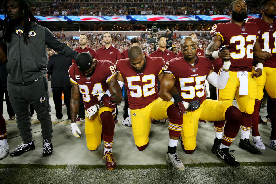 Washington Redskins players during the the national anthem before the game against the Oakland Raiders at FedExField on September 24, 2017 in Landover, Maryland. (Photo by Patrick Smith/Getty Images)