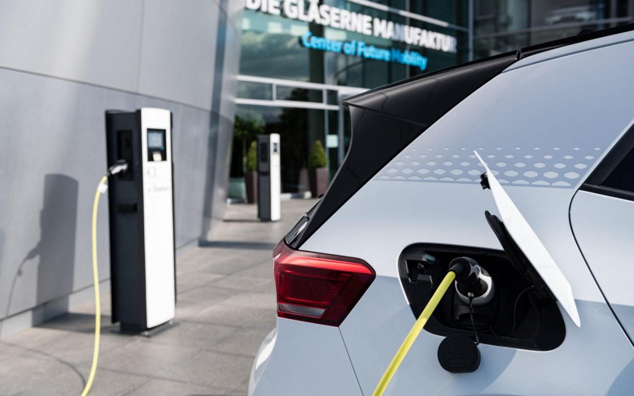 A new £620 million fund will continue to provide grants for electric vehicles as well as new on-street charging stations to help those without their own driveways - Jens Schlueter/AFP