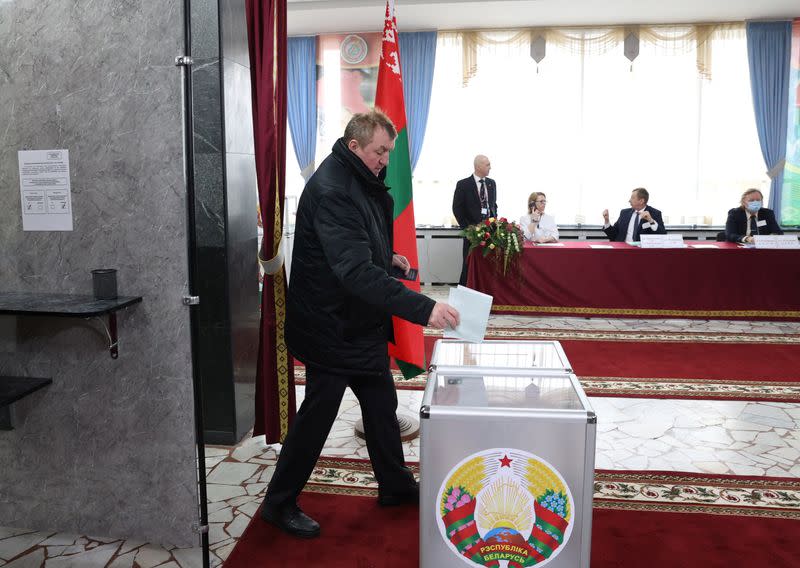 A man casts his ballot at constitutional referendum in Minsk