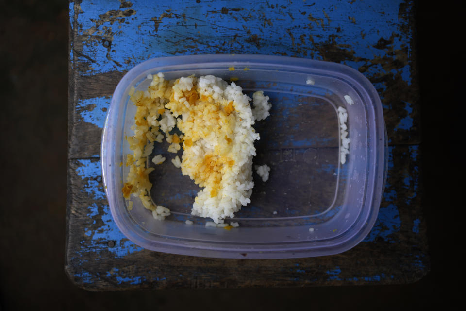 The lunch box sent for 8 years old Venura Madushan by his mother is seen in a school at Mahadamana village in Dimbulaga, about 200 kilometres north east of Colombo, Sri Lanka, Monday, Dec. 12, 2022. Due to Sri Lanka's current economic crisis families across the nation have been forced to cut back on food and other vital items because of shortages of money and high inflation. Many families say that they can barely manage one or two meals a day. (AP Photo/Eranga Jayawardena)