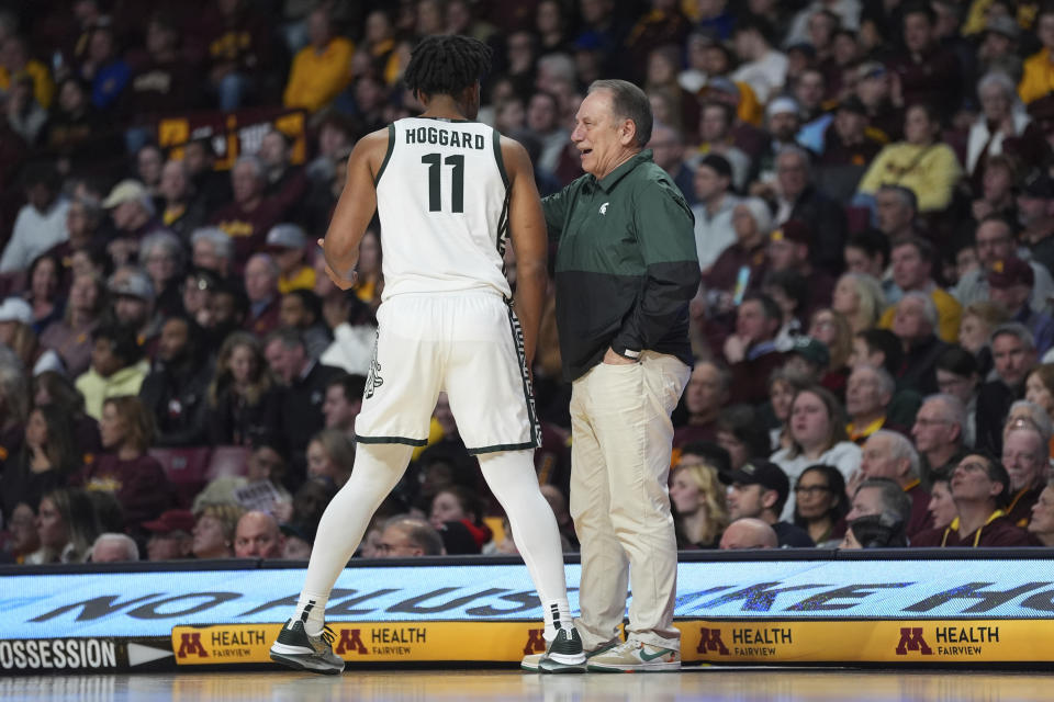 Michigan State guard A.J. Hoggard and coach Tom Izzo talk during the first half of the team's NCAA college basketball game against Minnesota, Tuesday, Feb. 6, 2024, in Minneapolis. (AP Photo/Abbie Parr)