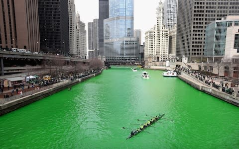 Rowers navigate the Chicago River shortly after it was dyed green in celebration of St. Patrick's Day on March 17, 2018 in Chicago, Illinois - Credit: Scott Olson/Getty Images