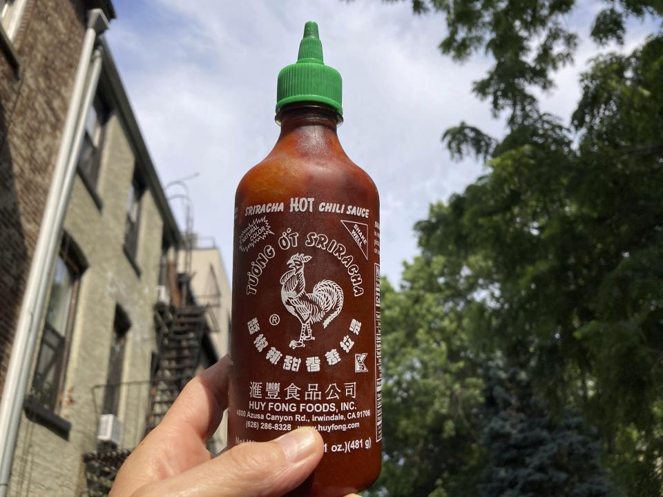A bottle of Sriracha chili sauce is shown in New York on Thursday, July 13, 2023. Huy Fong Sriracha, which used to go for under $5 or $10 a bottle, is now selling for shocking amounts in some listings posted to Amazon, eBay and Walmart. (AP Photo/Peter Morgan)