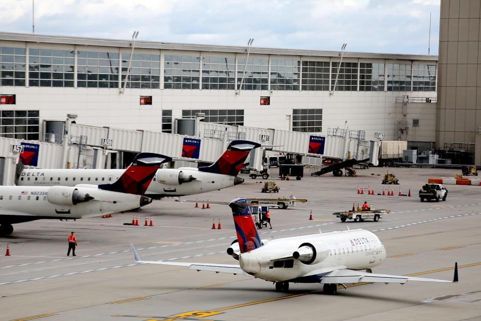 A Delta flight was delayed and returned to the gate after passengers refused to wear face masks.