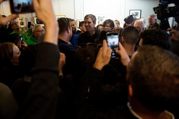 Beto O&#39;Rourke, Democratic candidate for president, enters a crush of people gathered to see him on Friday, March 15, 2019, in Washington, Iowa. It was O&#39;Rourke&#39;s first trip to Iowa after announcing his campaign.