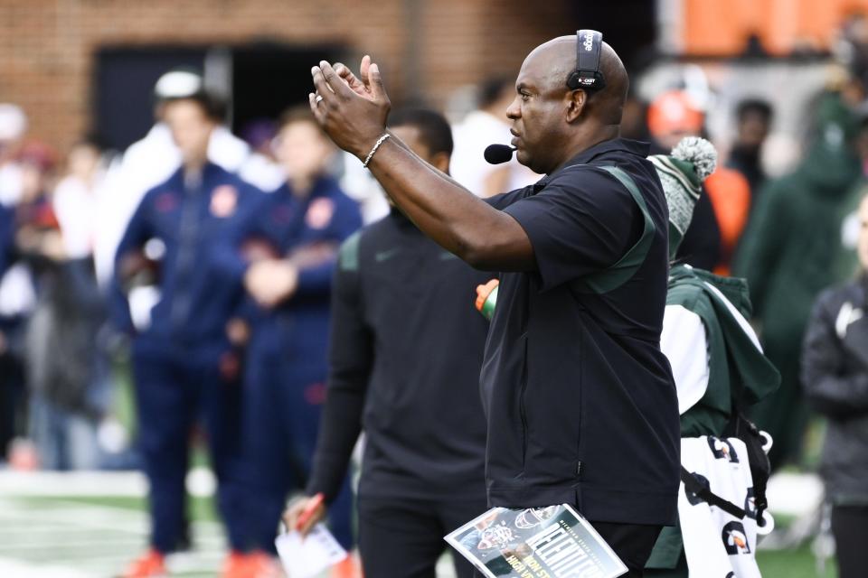 Michigan State head coach Mel Tucker claps for his team during the first half of an NCAA college football game against Illinois, Saturday, Nov. 5, 2022, in Champaign, Ill.