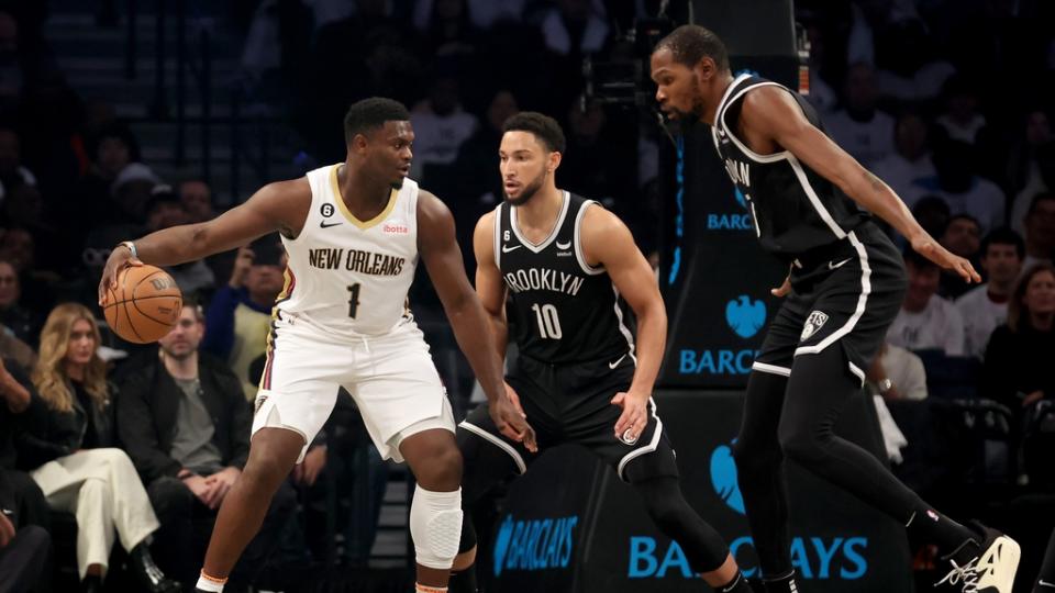 Oct 19, 2022; Brooklyn, New York, USA; New Orleans Pelicans forward Zion Williamson (1) controls the ball against Brooklyn Nets guard Ben Simmons (10) and forward Kevin Durant (7) during the first quarter at Barclays Center. Mandatory Credit: Brad Penner-USA TODAY Sports