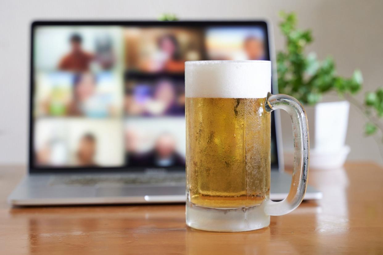 beer in front of laptop with video call