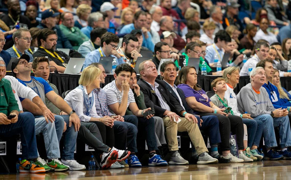 ACC Tournament fans enjoy court side seats in front of press row during the Duke vs Miami game on Friday, March 10, 2023 at the Greensboro Coliseum in Greensboro, N.C.