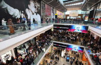 FILE PHOTO: Shoppers crowd the walkways on opening day of the Westfield Stratford City shopping centre in east London September 13, 2011. REUTERS/Suzanne Plunkett/File Photo