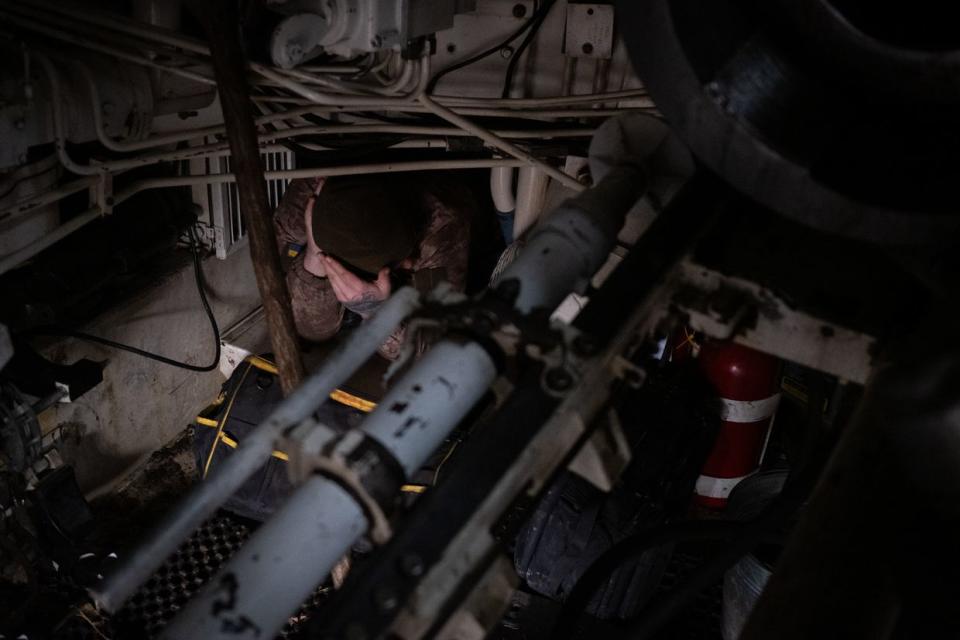 A Ukrainian artilleryman inside a M109 self-propelled howtizer at positions in Donetsk Oblast on Feb. 3, 2023. (Francis Farrell/The Kyiv Independent)