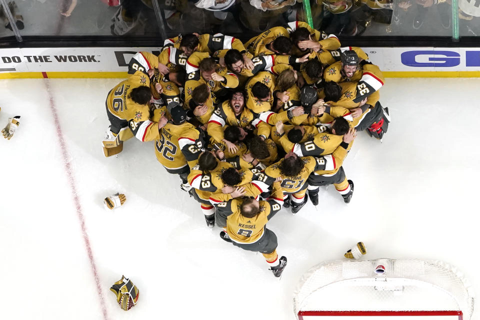 FILE - Members of the Vegas Golden Knights celebrate after they defeated the Florida Panthers 9-3 to win the Stanley Cup in Game 5 of the NHL hockey Stanley Cup Finals Tuesday, June 13, 2023, in Las Vegas. The photo was honored by the Associated Press Sports Editors as best sports feature photo of 2023 at their annual winter meeting. (AP Photo/Abbie Parr, File)