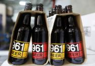 Bottles of 961 Beer are seen inside a beer factory in Mazraat Yachouh