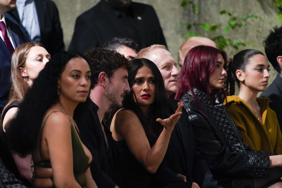 From second left, Paul Mescal, Selma Hayek, François-Henri Pinault and Dua Lipa attend the Gucci Cruise fashion show in London, Monday, May 13, 2024. (Photo by Alberto Pezzali/Invision/AP)