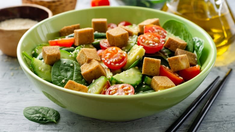 Salad with tofu and vegetables in bowl