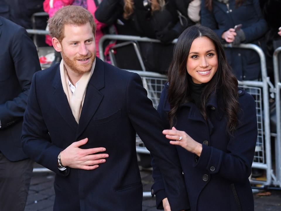 Prince Harry and fiancee Meghan Markle attend the Terrance Higgins Trust World AIDS Day charity fair at Nottingham Contemporary on December 1, 2017 in Nottingham, England. Prince Harry and Meghan Markle announced their engagement on Monday 27th November 2017 and will marry at St George's Chapel, Windsor Castle in May 2018