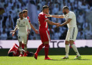 Soccer Football - La Liga Santander - Real Madrid v Girona - Santiago Bernabeu, Madrid, Spain - February 17, 2019 Girona's Alex Granell and Real Madrid's Karim Benzema react REUTERS/Susana Vera