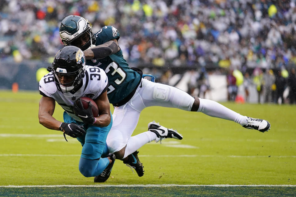 Jacksonville Jaguars' Jamal Agnew scores a touchdown in front of Philadelphia Eagles' C.J. Gardner-Johnson during the first half of an NFL football game Sunday, Oct. 2, 2022, in Philadelphia. (AP Photo/Matt Rourke)