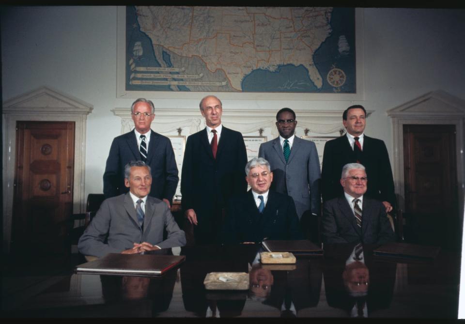 Members of the Board of Governors of the Federal Reserve System, including Andrew Brimmer, standing, second from right, pose for a group photo. <a href="https://www.gettyimages.com/detail/news-photo/members-of-the-board-of-governors-of-the-federal-reserve-news-photo/516482880?adppopup=true" rel="nofollow noopener" target="_blank" data-ylk="slk:Bettmann via Getty Images;elm:context_link;itc:0;sec:content-canvas" class="link ">Bettmann via Getty Images</a>