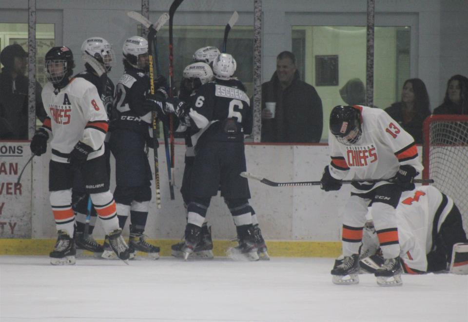 Sault players celebrate a goal scored by Evan Kennedy (18) during the first period at Cheboygan on Wednesday.