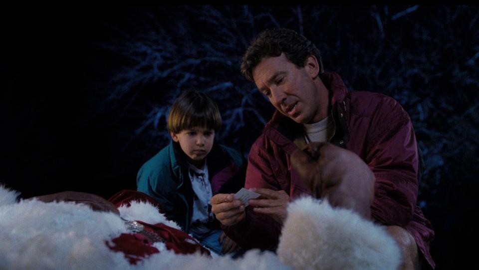 tim allen in the santa clause and his son read a note left in santa's clothes