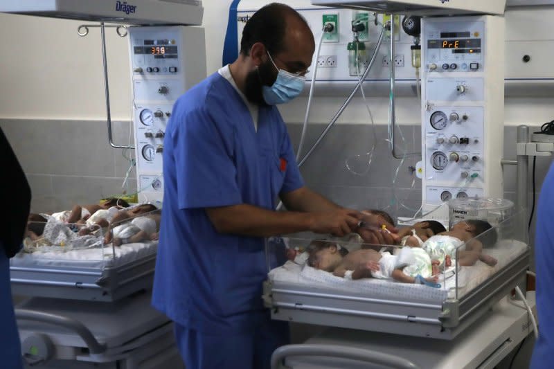 Palestinian medics care for babies evacuated from Al Shifa hospital to the Emirates hospital in Rafah in the southern Gaza Strip on Sunday. Photo by Ismail Muhammad/UPI