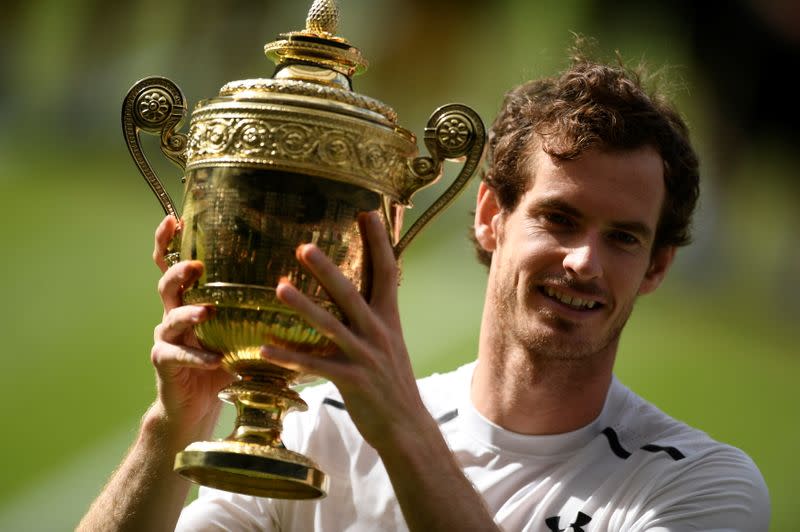 FILE PHOTO: Britain's Andy Murray holds aloft the trophy after winning the 2016 Wimbledon men's singles final