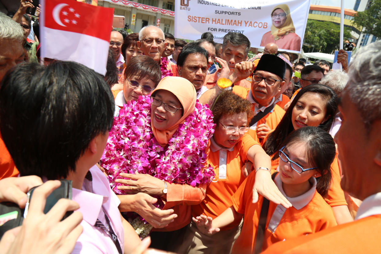 President-elect Halimah Yacob is mobbed by supporters at the People’s Association headquarters on Wednesday (13 September). (PHOTO: Dhany Osman / Yahoo News Singapore)