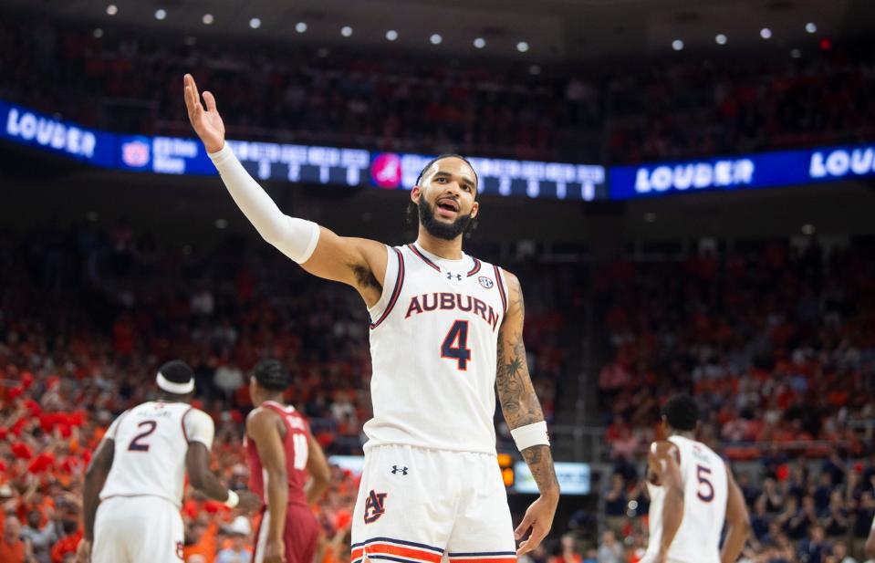 Auburn Tigers forward Johni Broome (4) pumps up the crowd as Auburn Tigers take on Alabama Crimson Tide at Neville Arena in Auburn, Ala., on Wednesday, Feb. 7, 2024. Auburn Tigers lead Alabama Crimson Tide 55-41 at halftime.