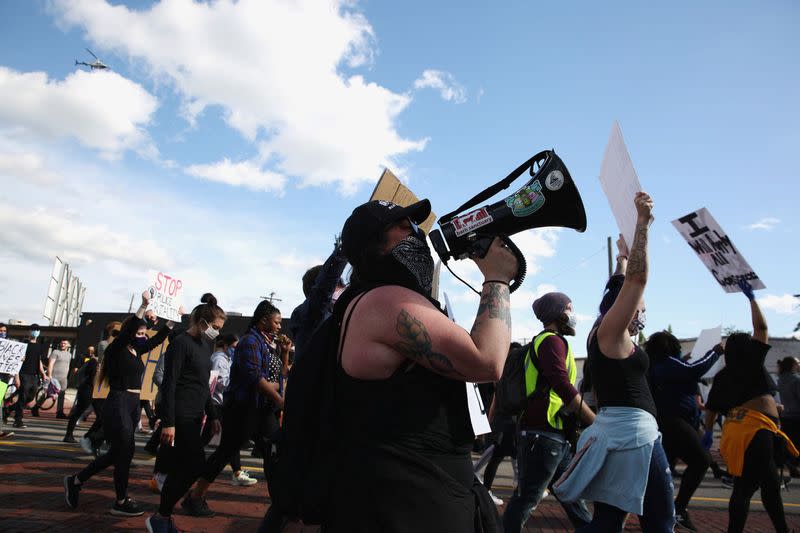 Protest against the death in Minneapolis police custody of African-American man George Floyd and the assault of Sha'Teina and Dan Grady El by Washtenaw County police, in Detroit